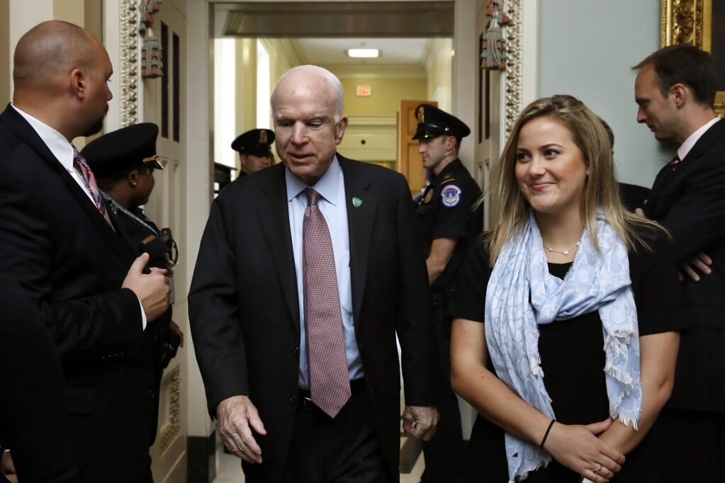 Sen. John McCain, R-Ariz., leaves meeting of Senate Republicans, Tuesday, Sept. 19, 2017, on Capitol Hill in Washington. (AP Photo/Jacquelyn Martin)