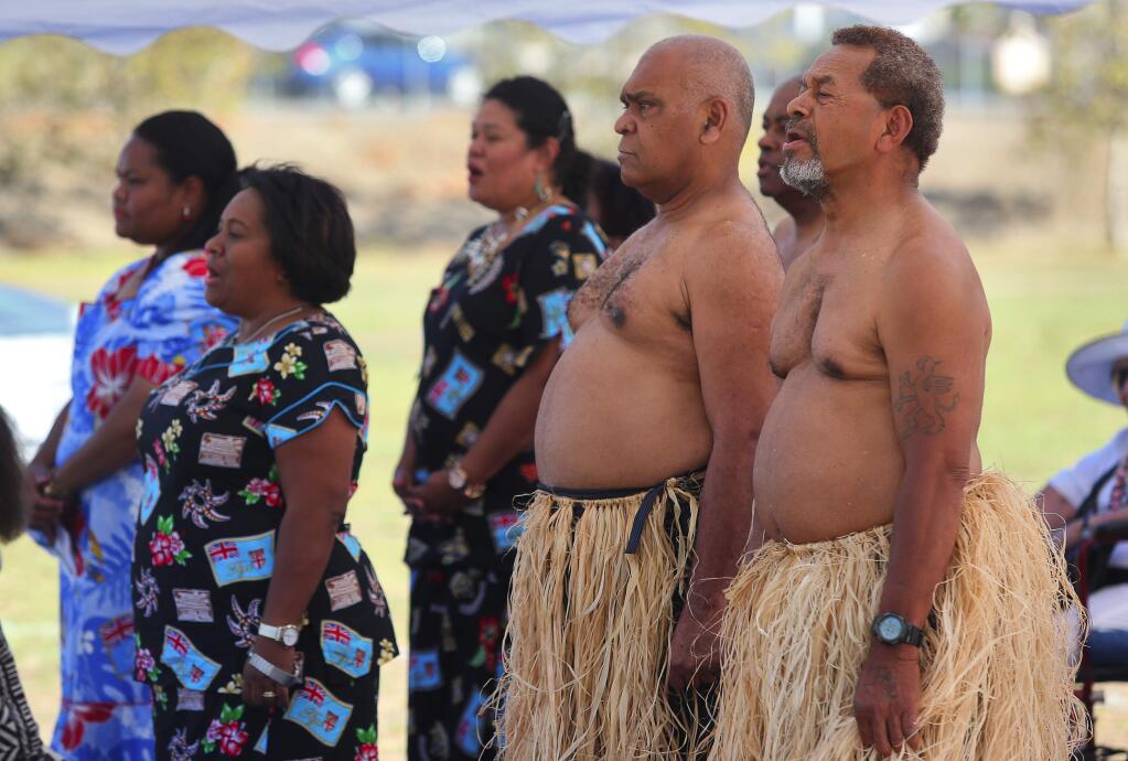 Fijians sing the Fiji National Anthem as the flag is raised during the Fiji Independence celebration at the Sonoma County Fairgrounds, in Santa Rosa, on Friday, October 9, 2015. (Christopher Chung/ The Press Democrat)