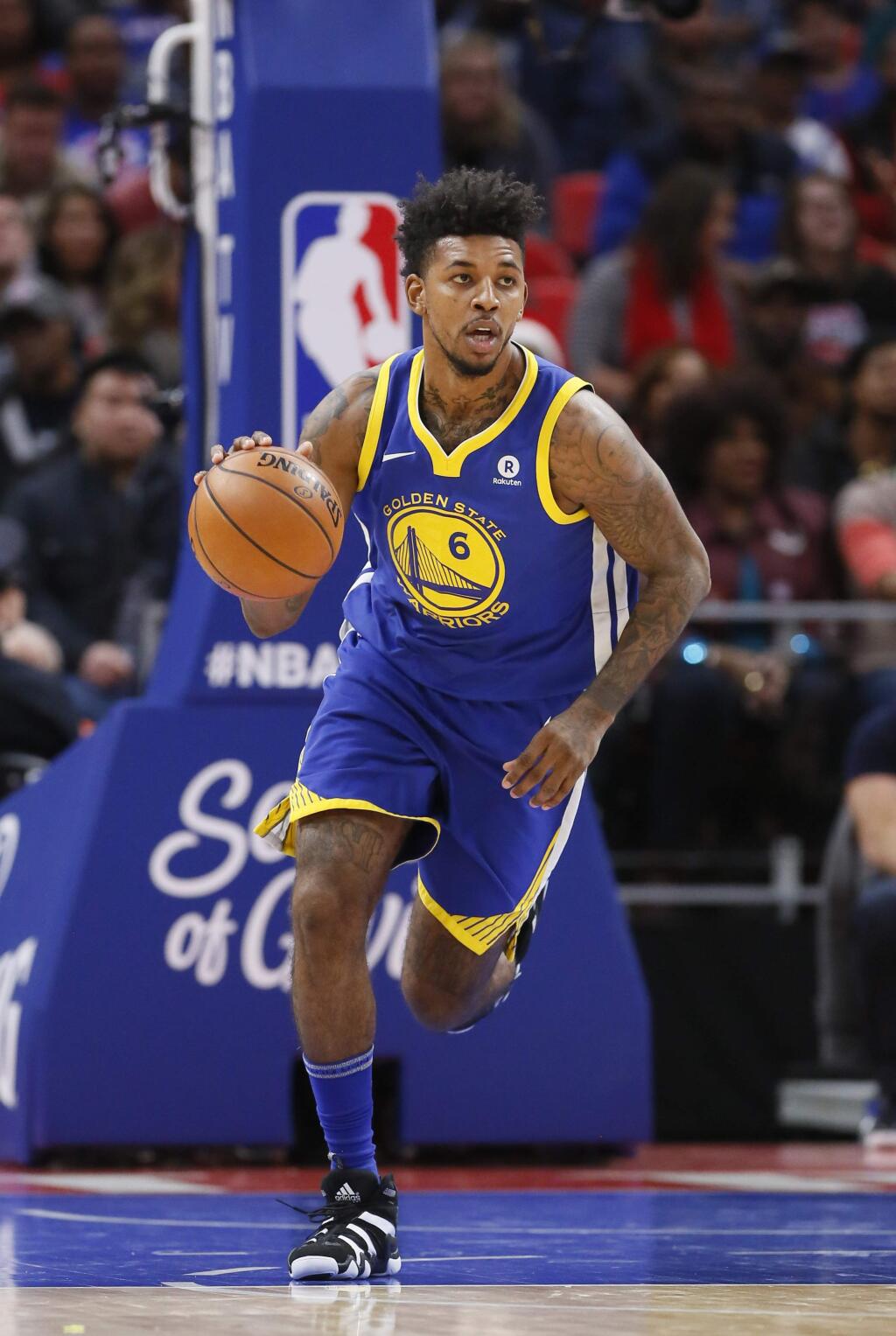 Golden State Warriors guard Nick Young brings the ball up court against the Detroit Pistons during the second quarter Friday, Dec. 8, 2017, in Detroit. (AP Photo/Duane Burleson)