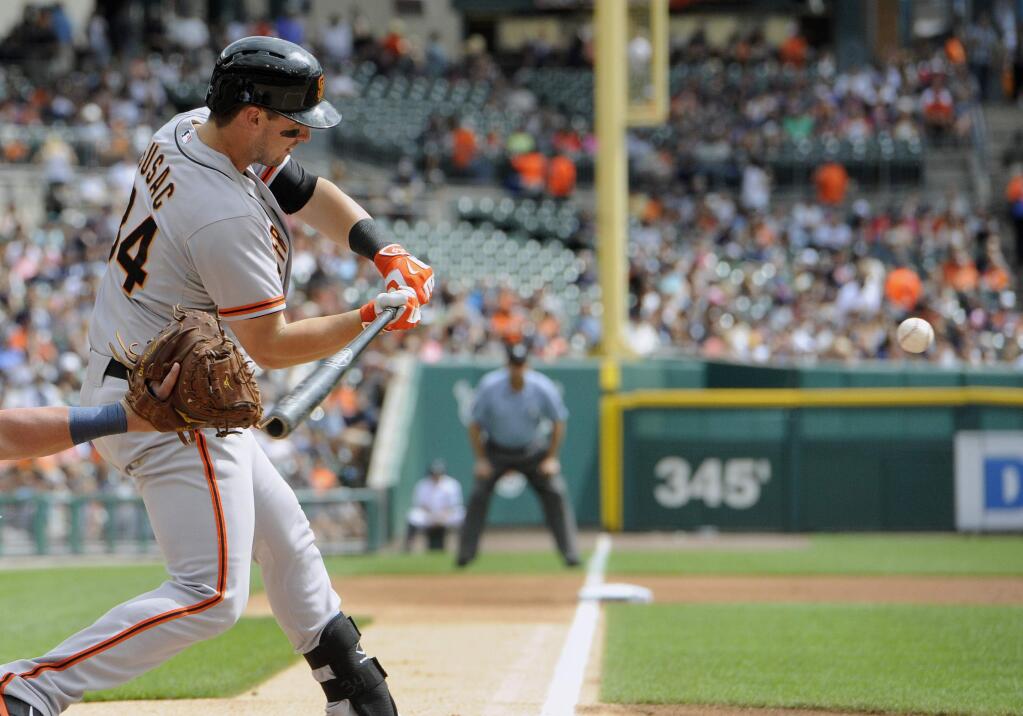 San Francisco Giants' Andrew Susac hits a two-run double against the Detroit Tigers in the first inning of a baseball game Saturday, Sept. 6, 2014, in Detroit, Mich. (AP Photo/Jose Juarez)
