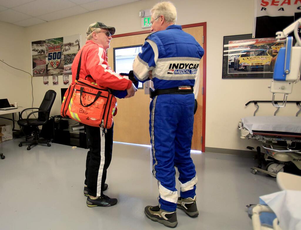 Sonoma Raceway emergency room physician Dr. Brian Schmidt , left, talks with IndyCar doctor Geoff Billows, Friday, Aug. 28, 2015 in the ER at the raceway. (Kent Porter / Press Democrat) 2015