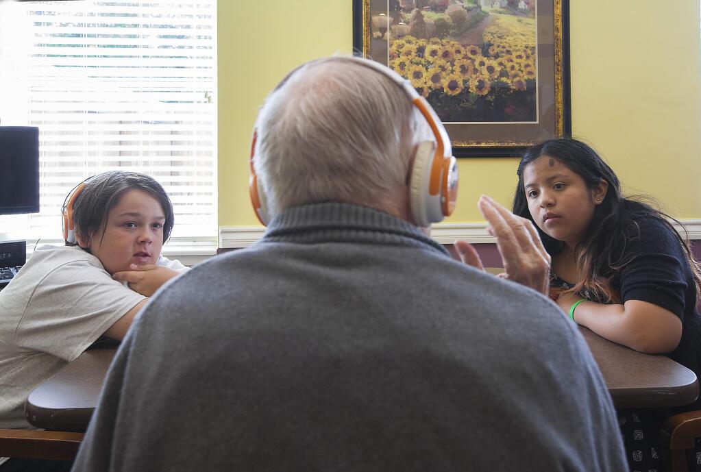 Owen Nelson (left) and Rosa Valentine ask Pentii Hakala about his favorite classical music. Alive Inside, a national music-and-memory program, has its second pilot program in Sonoma. (Photos by Robbi Pengelly/Index-Tribune)
