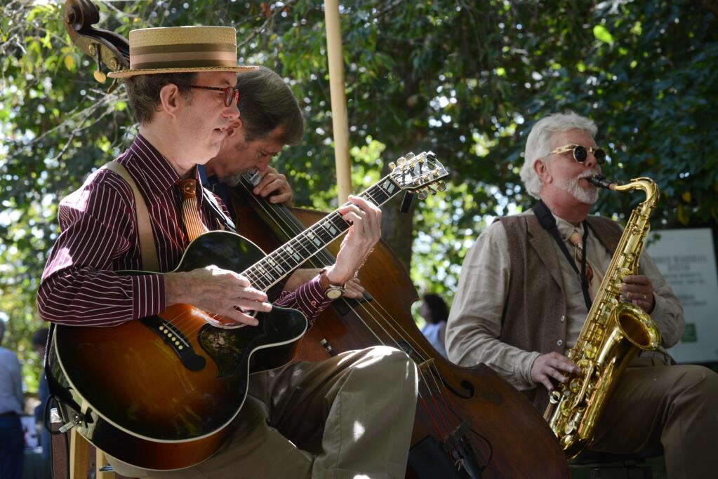 Members of The Hot House Jazz Band, from left, Bill Dekuiper, Tom Shader and Jack Schaeffe providing musical entertainment during the Sonoma County Wine Auction held at La Crema Estate at Saralee's Vineyard Saturday, in Windsor, California. September 22, 2018. (Photo: Erik Castro/for The Press Democrat)