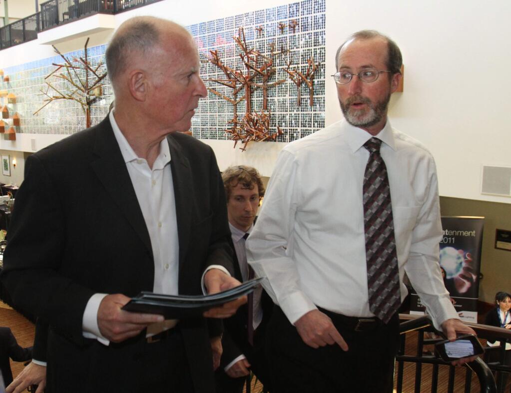 FILE -- In this April 5, 2011 file photo Gov. Jerry Brown, left, talks with adviser Steve Glazer, after making a speech in Sacramento, Calif. (AP Photo/Rich Pedroncelli, file)