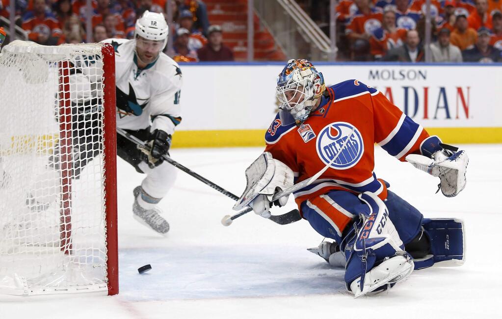 San Jose Sharks center Patrick Marleau scores on Edmonton Oilers goalie Cam Talbot during the first period of Game 5 of a first-round Stanley Cup playoff series, Thursday, April 20, 2017, in Edmonton, Alberta. (Jeff McIntosh/The Canadian Press via AP)