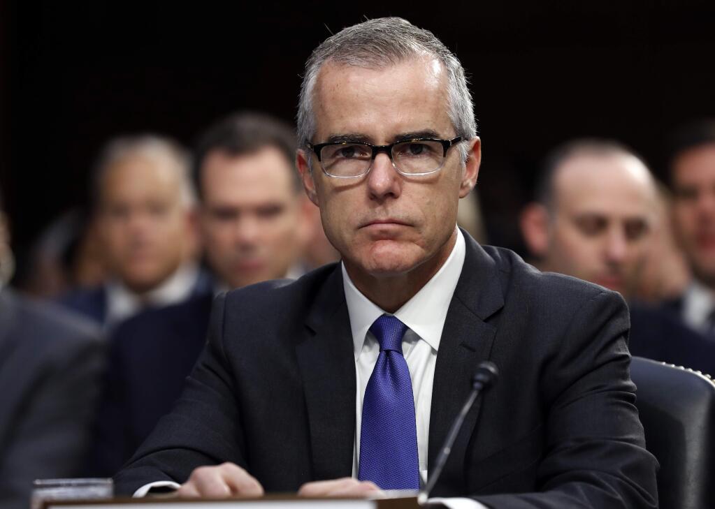 FILE - In this June 7, 2017 file photo, acting FBI Director Andrew McCabe appears before a Senate Intelligence Committee hearing about the Foreign Intelligence Surveillance Act on Capitol Hill in Washington. Attorney General Jeff Sessions said Friday, March 16, 2018, that he has fired former FBI Deputy Director McCabe, a longtime and frequent target of President Donald Trump's anger, just two days before his scheduled retirement date. (AP Photo/Alex Brandon, File)