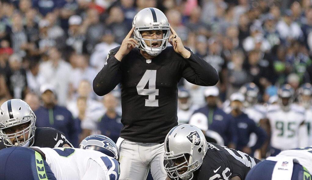 Raiders quarterback Derek Carr will be the only rookie to start at quarterback for an NFL team this weekend. (Associated Press / Ben Margot)