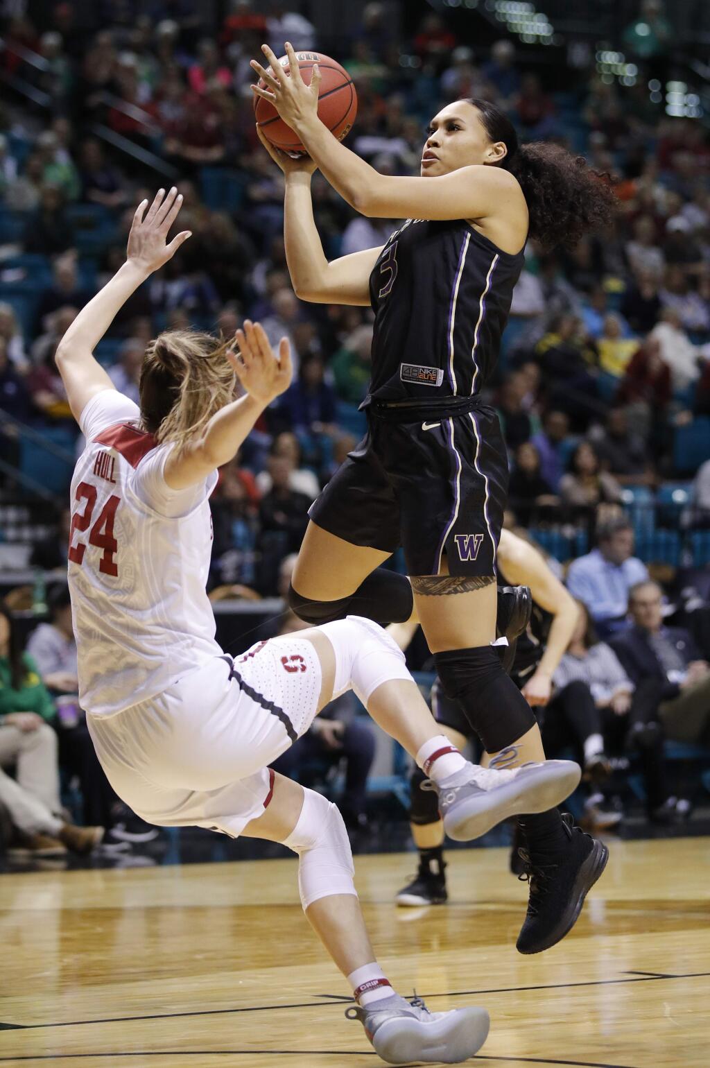 Washington's Mai-Loni Henson drives into Stanford's Lacie Hull during the first half in the semifinals of the Pac-12 women's tournament Saturday, March 9, 2019, in Las Vegas. (AP Photo/John Locher)