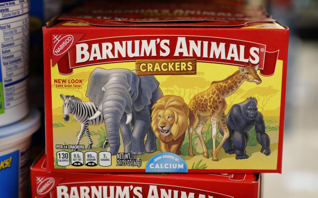 This Monday, Aug. 20, 2018, photo shows a box of Nabisco Barnum's Animals crackers on the shelf of a local grocery store in Des Moines, Iowa. Mondelez International says it has redesigned the packaging of its Barnum's Animals crackers after relenting to pressure from People for the Ethical Treatment of Animals. (AP Photo/Charlie Neibergall)
