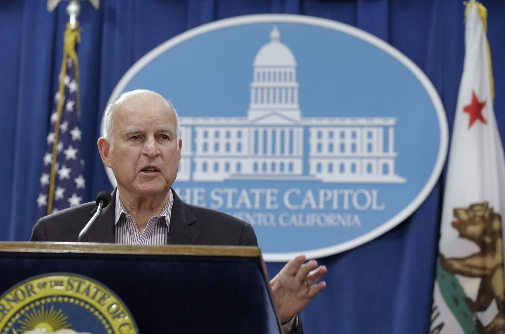 Gov. Jerry Brown discusses his revised 2018-19 state budget at a Capitol news conference Friday, May 11, 2018, in Sacramento, Calif. (AP Photo/Rich Pedroncelli)