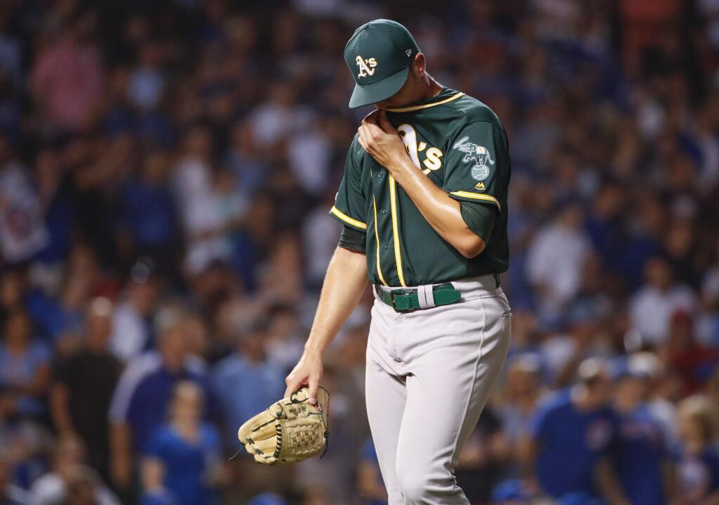 Oakland Athletics relief pitcher Blake Treinen leaves a game against the Chicago Cubs during the seventh inning, Monday, Aug. 5, 2019, in Chicago. (AP Photo/Kamil Krzaczynski)