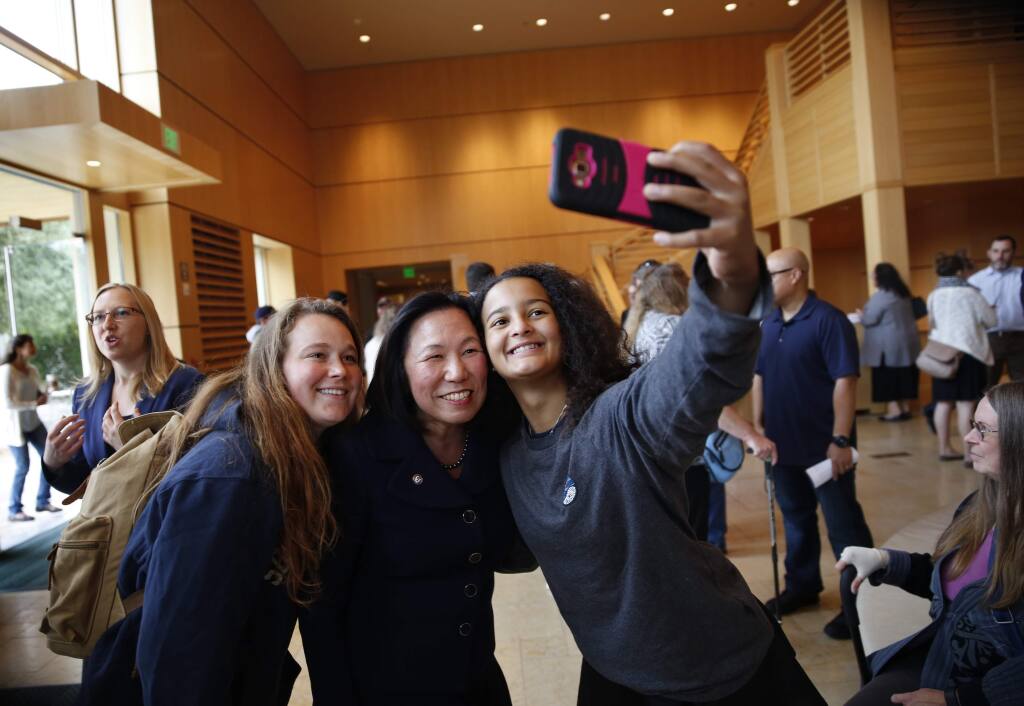Sonoma State University President Judy Sakaki, center, poses for a photo with juniors Sophia Mahoney-Rohrl, left, and Emily Milesi before her first convocation at the Green Music Center on the Sonoma State University campus in Rohnert Park, on Monday, August 22, 2016. (BETH SCHLANKER/ The Press Democrat)