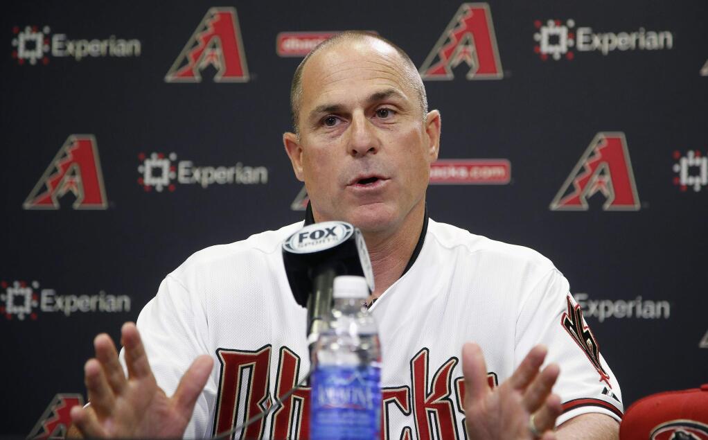 New Arizona Diamondbacks baseball team manager Chip Hale talks about managing the club during a news conference Monday, Oct. 13, 2014, in Phoenix. The former Diamondbacks third base coach was hired Monday to replace fired Kirk Gibson as the Diamondbacks manager. The 49-year-old managed in Arizona's minor league system for six seasons and was with the Diamondbacks from 2007-09 in the first of eight consecutive seasons as a big league third base coach. (AP Photo/Ross D. Franklin)