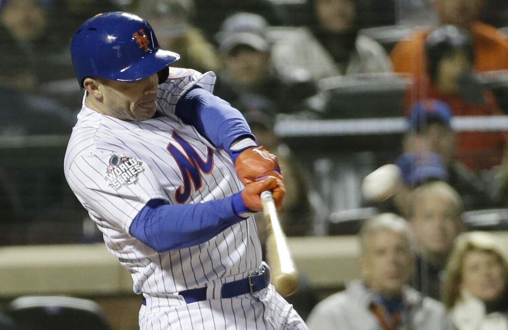 New York Mets' David Wright hits a two-run home run during the first inning of Game 3 of the Major League Baseball World Series against the Kansas City Royals Friday, Oct. 30, 2015, in New York. (AP Photo/David J. Phillip)