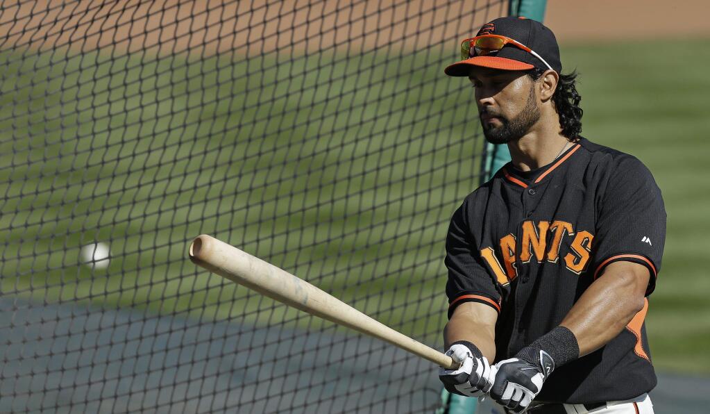 Giants center fielder Angel Pagan is sitting with a bad back, but the team says it's unrelated to last season's back problems. (Ben Margot / Associated Press)