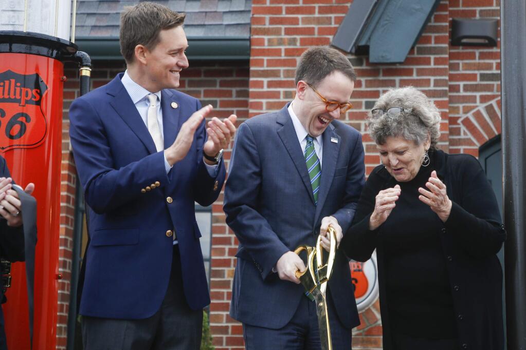 FILE - In this Nov. 6, 2019 file photo, Lieutenant Governor Matt Pinnell watches as Mayor G.T. Bynum and District 2 Councilor Jeannie Cue celebrate after cutting a ribbon during the opening of the Route 66 Village Station in Tulsa. Republican Sen. Nathan Dahm said Wednesday, Nov. 6, 2019 that he is done trying to rename a portion of the iconic Route 66 highway in northeastern Oklahoma after President Donald Trump. (Ian Maule/Tulsa World via AP, File)