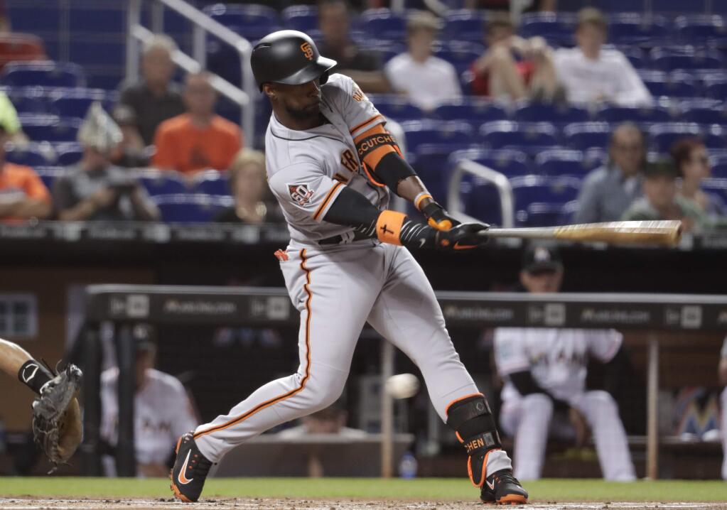 The San Francisco Giants' Andrew McCutchen strikes out during the first inning against the Miami Marlins, Tuesday, June 12, 2018, in Miami. (AP Photo/Lynne Sladky)
