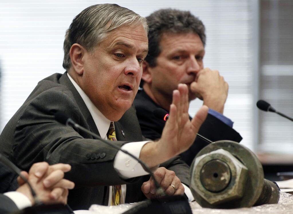 In this April 10, 2013 file photo, Caltrans Toll Bridge Program Manager Tony Anziano refers to one of the broken rods he brought from the San Francisco-Oakland Bay Bridge project during a presentation before the Bay Area Toll Authority oversight committee in Oakland, Calif. (AP Photo/The Contra Costa Times,Karl Mondon, File)