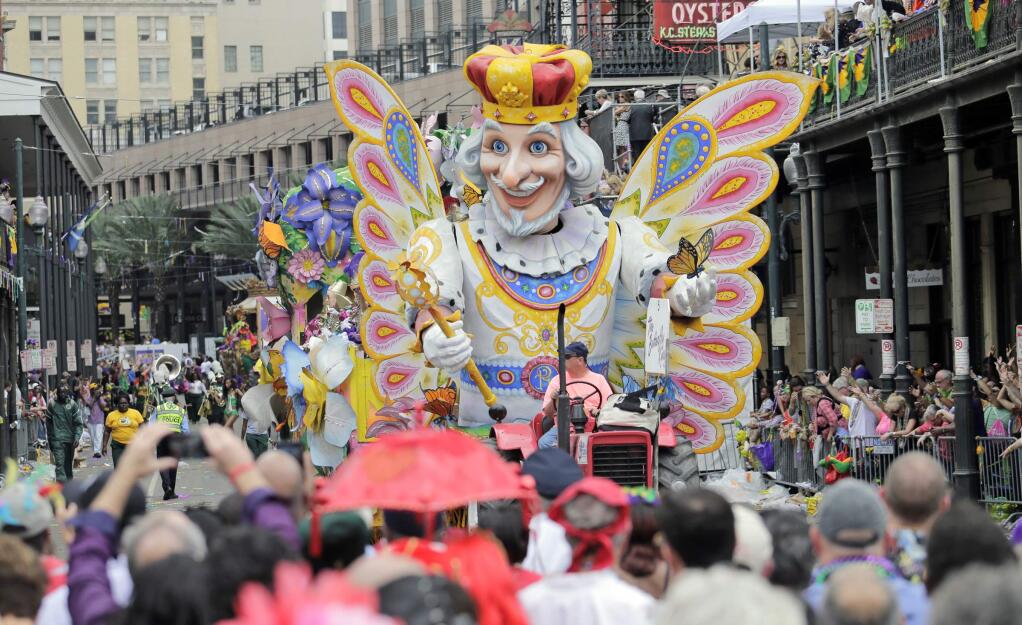 The Rex parade rolls down St. Charles Avenue nearing Canal Street during the Society of Saint Anne Mardi Gras parade in New Orleans on Tuesday, Feb. 28, 2017. (Brett Duke/NOLA.com The Times-Picayune via AP)