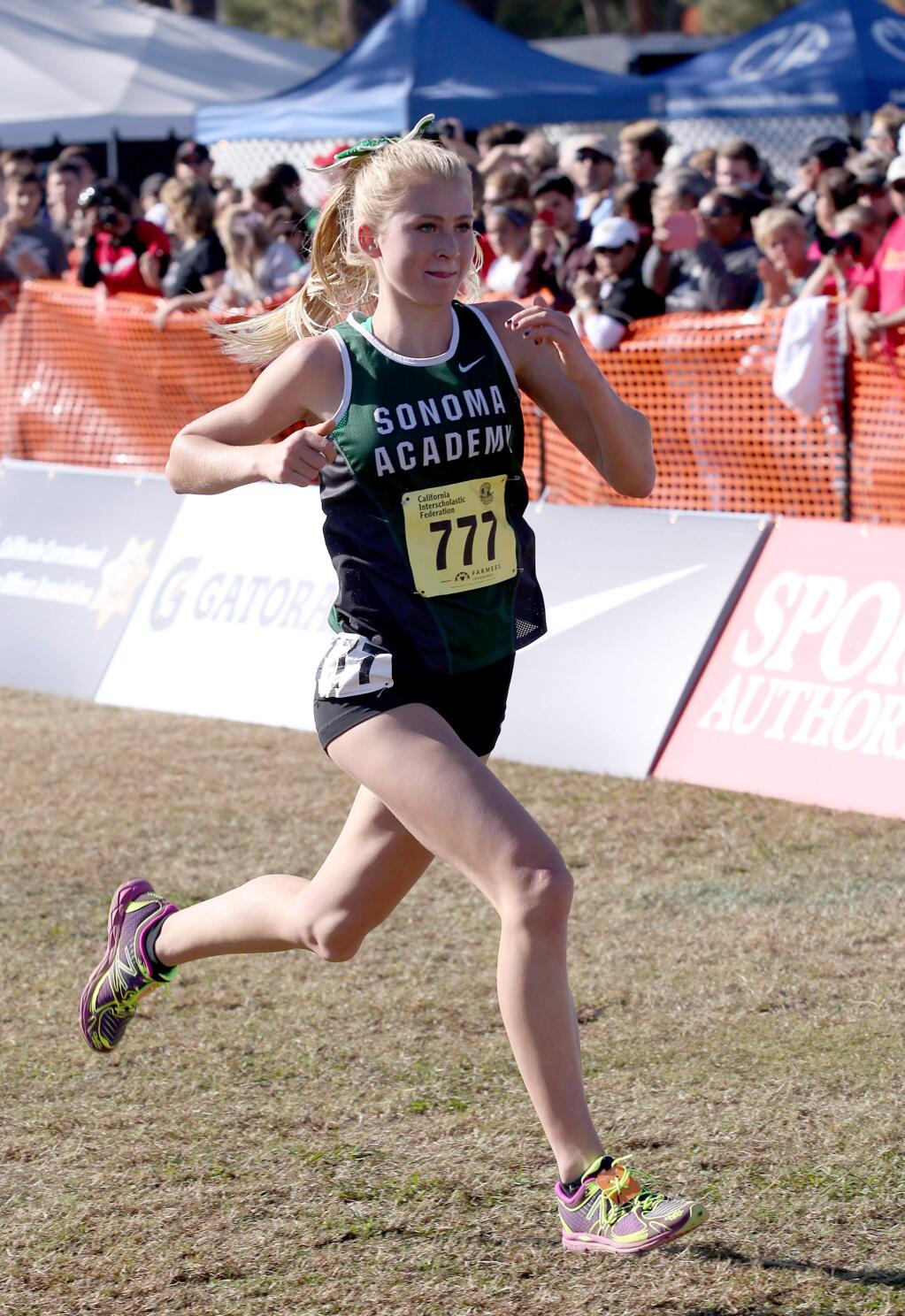 Sonoma Academy's Rylee Bowen, ran to the finish line in first place in Division 5 with a time of 18:36 during the 2014 CIF State Cross Country Championships held at Woodward Park in Fresno, Saturday, November 29, 2014. (Crista Jeremiason/The Press Democrat)