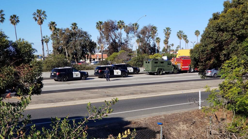 Ventura Police Department and Ventura Fire Department are parked along with California Highway Patrol on Interstate 101, Wednesday, Feb. 21, 2018, in Ventura, Calif. A rape suspect died after drinking cyanide during a freeway chase in Southern California on Wednesday, authorities said. Jonathan Hanks, 33, of Camarillo, was pulled from his car and pronounced dead at the scene on Interstate 101. (Christian Martinez/The Ventura County Star via AP)