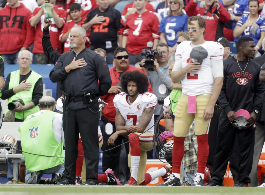 San Francisco 49ers quarterback Colin Kaepernick (7) kneels during the national anthem before a game against the Buffalo Bills on Sunday, Oct. 16, 2016, in Orchard Park, N.Y. (AP Photo/Mike Groll)
