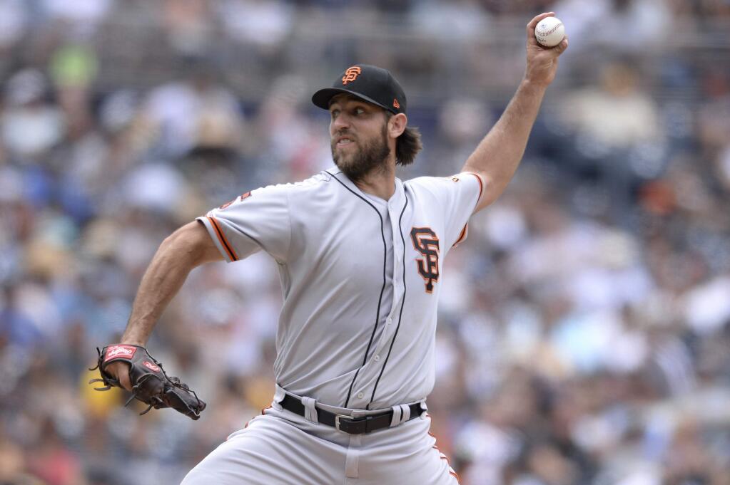 San Francisco Giants starting pitcher Madison Bumgarner works against a San Diego Padres batter during the second inning of a baseball game Sunday, July 28, 2019, in San Diego. (AP Photo/Orlando Ramirez)
