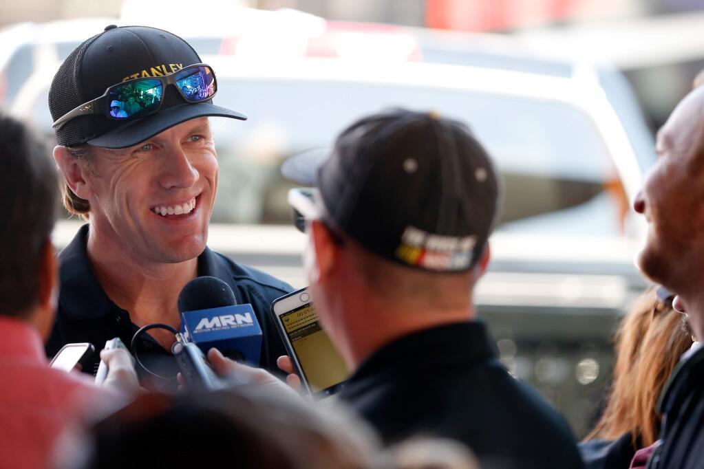 Former NASCAR driver Carl Edwards, left, answers media questions after a sponsorship appearance during qualifying for the Monster Energy NASCAR Cup Series Toyota/Save Mart 350 at Sonoma Raceway, in Sonoma, California on Saturday, June 24, 2017. (Alvin Jornada / The Press Democrat)