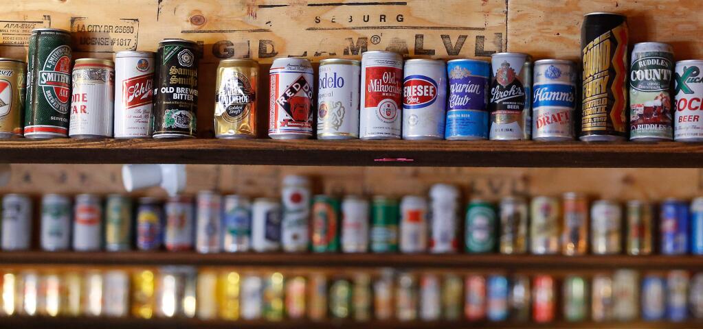 Vintage beer cans decorate the loft ceiling at Lagunitas Brewing Company in Petaluma, California on Tuesday, August 9, 2016. (Alvin Jornada / The Press Democrat)