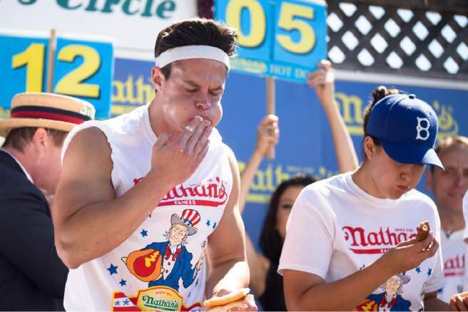 Brian 'Dud Light' Dudzinski enjoys the early stages of an expected 72 hour digestion period following the June 28 hot dog eating contest. (Photo by Owen Barrett/Index-Tribune)