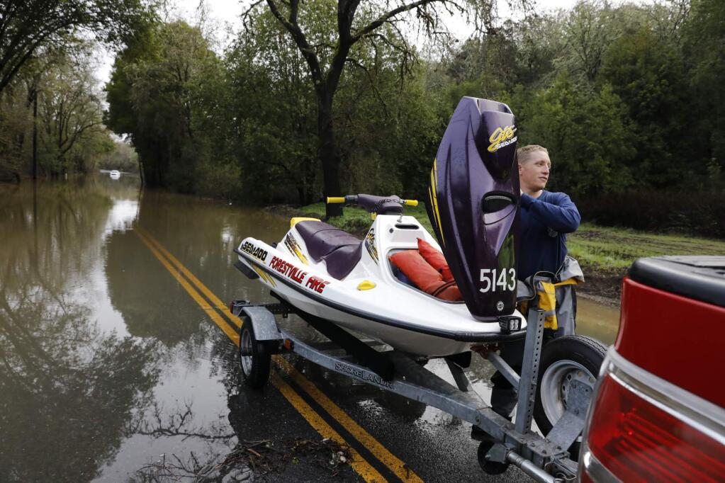 Trenton Road in Healdsburg remained flooded due to recent storms, Friday, Feb. 10, 2017. (Beth Schlanker / Press Democrat)