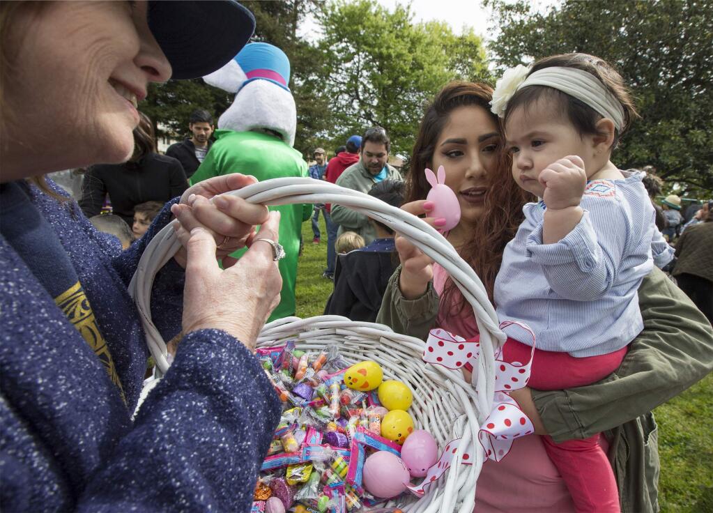 The Soroptimists' annual Easter egg hunt on the Plaza took place on Saturday, just after 10 a.m. Thirty seconds is all it took for the horde of children to scoop up hundreds of candy-filed plastic eggs. The Easter bunny then handed out hugs and candy to one and all. (Photo by Robbi Pengelly/Index-Tribune)