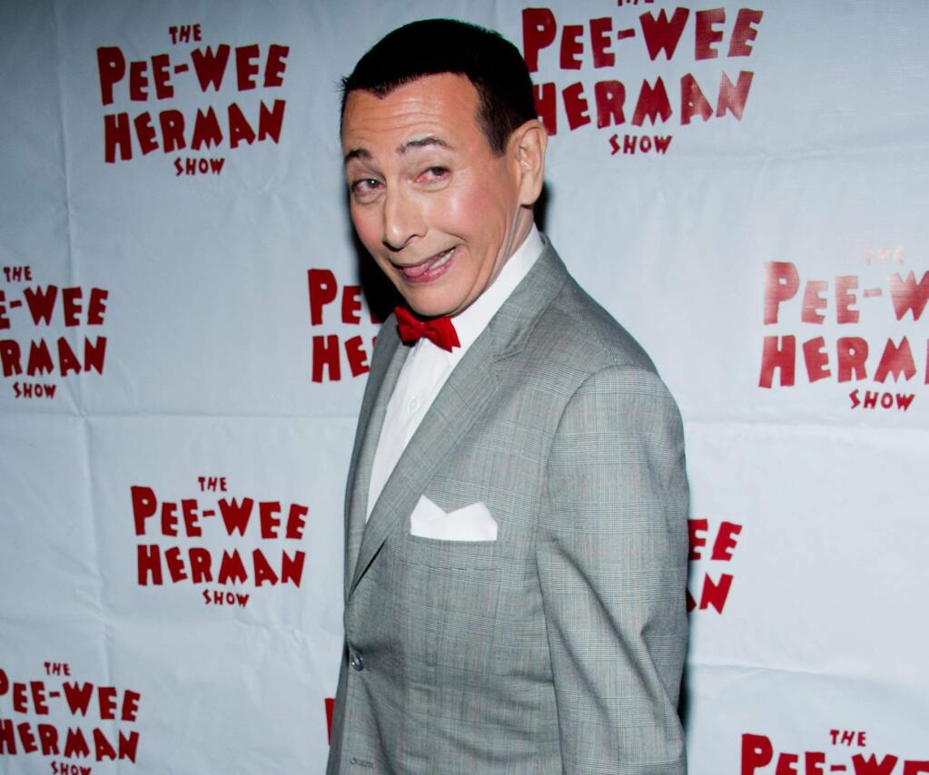 FILE - In this Nov. 11, 2010 file photo, Paul Reubens, in character as Pee-wee Herman, attends the after-party for the opening night of 'The Pee-wee Herman Show' on Broadway in New York. Hermans next adventure is coming to Netflix. The online video company says on Tuesday, Feb. 24, 2015, it will debut a new film featuring Paul Reubens as the bow tie-clad character from stage, TV and film. (AP Photo/Charles Sykes, File)
