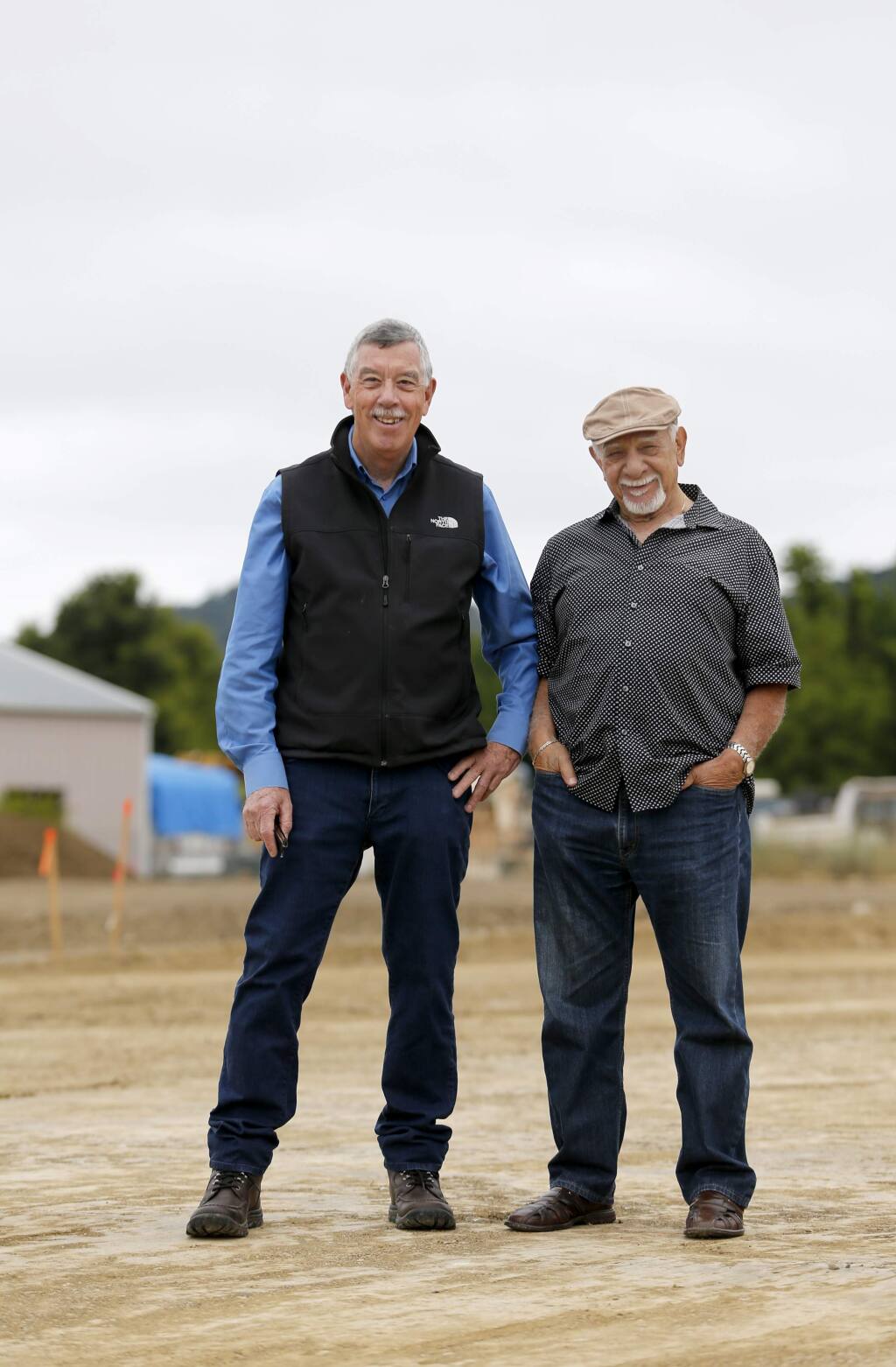 Christopher Paige, left, the CEO of California Human Development, and George L. Ortiz, stand at the construction site of a 30-unit apartment complex for low- income farmworkers. Photo taken in Santa Rosa, on Tuesday, June 7, 2016. (BETH SCHLANKER/ The Press Democrat)