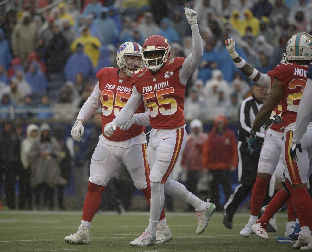 AFC linebacker Dee Ford (55), of the Kansas City Chiefs, celebrates against the NFC during the first half of the NFL Pro Bowl football game Sunday, Jan. 27, 2019, in Orlando, Fla. (AP Photo/Phelan Ebenhack)