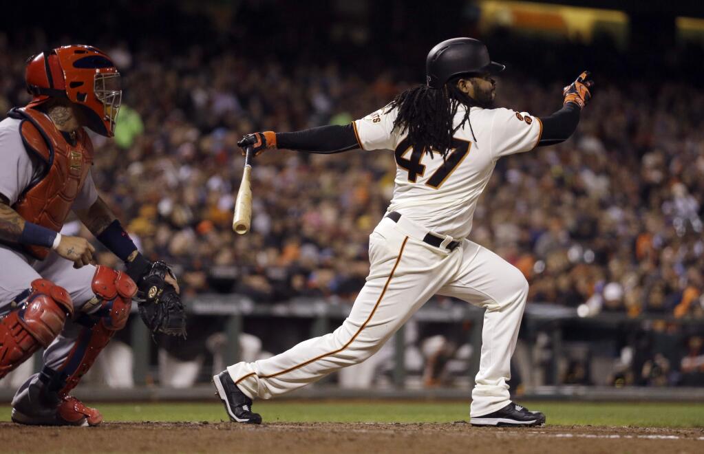 San Francisco Giants' Johnny Cueto watches his RBI sacrifice fly against the St. Louis Cardinals during the fourth inning of a baseball game Thursday, Sept. 15, 2016, in San Francisco. (AP Photo/Ben Margot)