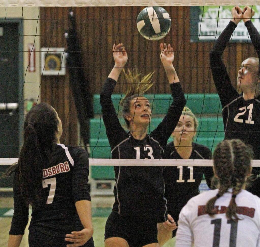Bill Hoban/Index-TribuneSonoma's Gigi Girish (13) reacts to a block in Tuesday night's match against Healdsburg, while Layla Schoeningh (11) and Emma Maggioncalda (21) move toward the ball. Sonoma beat Healdsburg Tuesday and Maria Carrillo on Wednesday.