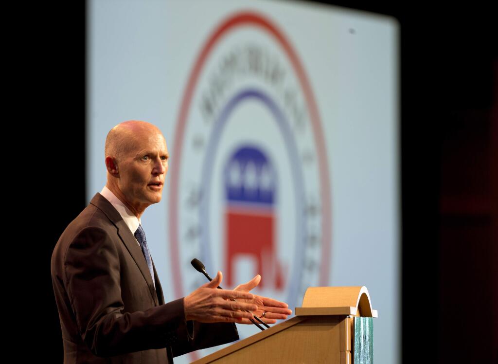 Florida Gov. Rick Scott is traveling to California to recruit businesses. (Associated Press)
