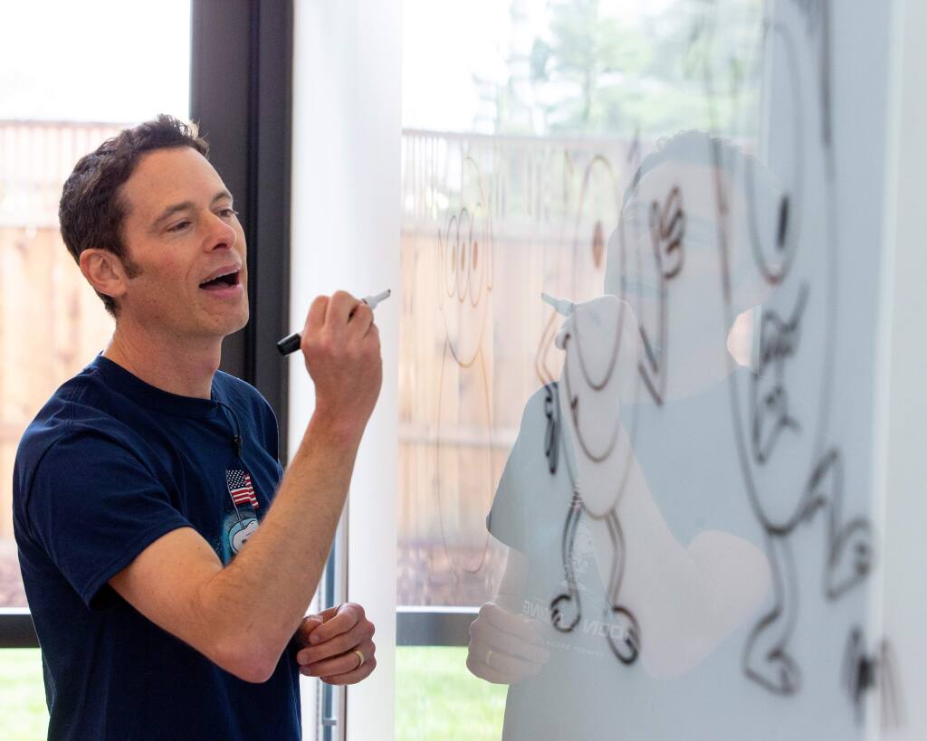 Illustrator and animator Matthew Luhn shows attendees of all ages how to draw characters from the Pixar animated films he has worked on, at the Charles M. Schulz Museum and Research Center in Santa Rosa, California, on Saturday, January 11, 2020. (Alvin Jornada / The Press Democrat)
