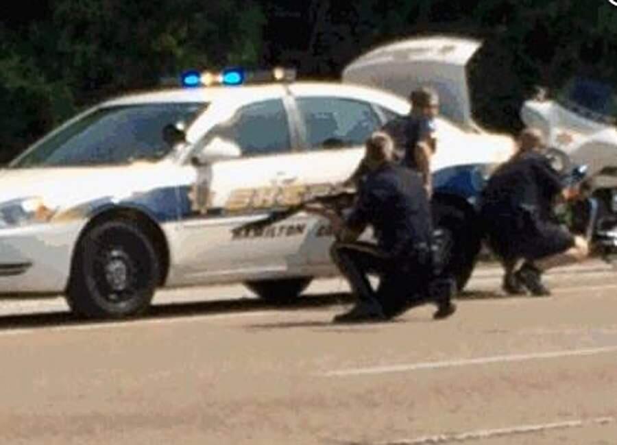 In this image made from video and released by WRCB-TV, authorities work an active shooting scene on amincola highway near the Naval Reserve Center, in Chattanooga, Tenn. on Thursday, July 16, 2015. Chattanooga Mayor Andy Berke says police are pursuing an active shooter after reports of a shooting at the military reserve center. (WRCB-TV via AP) MANDATORY CREDIT