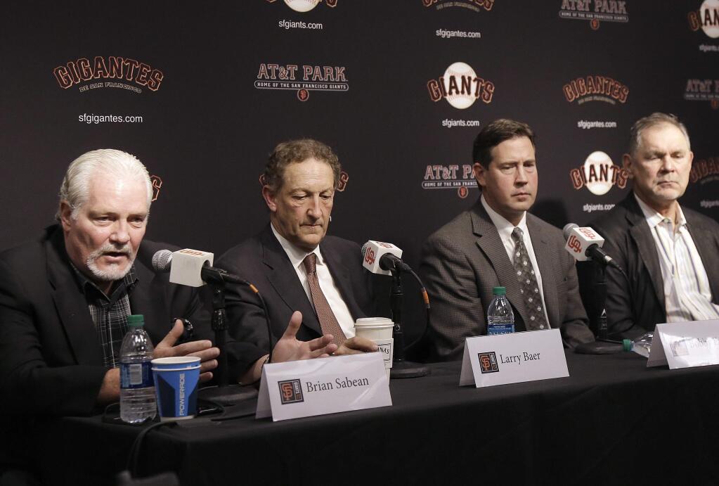 San Francisco Giants executive vice president of baseball operations Brian Sabean, from left, speaks next to CEO Larry Baer, general manager Bobby Evans and manager Bruce Bochy at a news conference in San Francisco, Tuesday, Oct. 3, 2017. (AP Photo/Jeff Chiu)