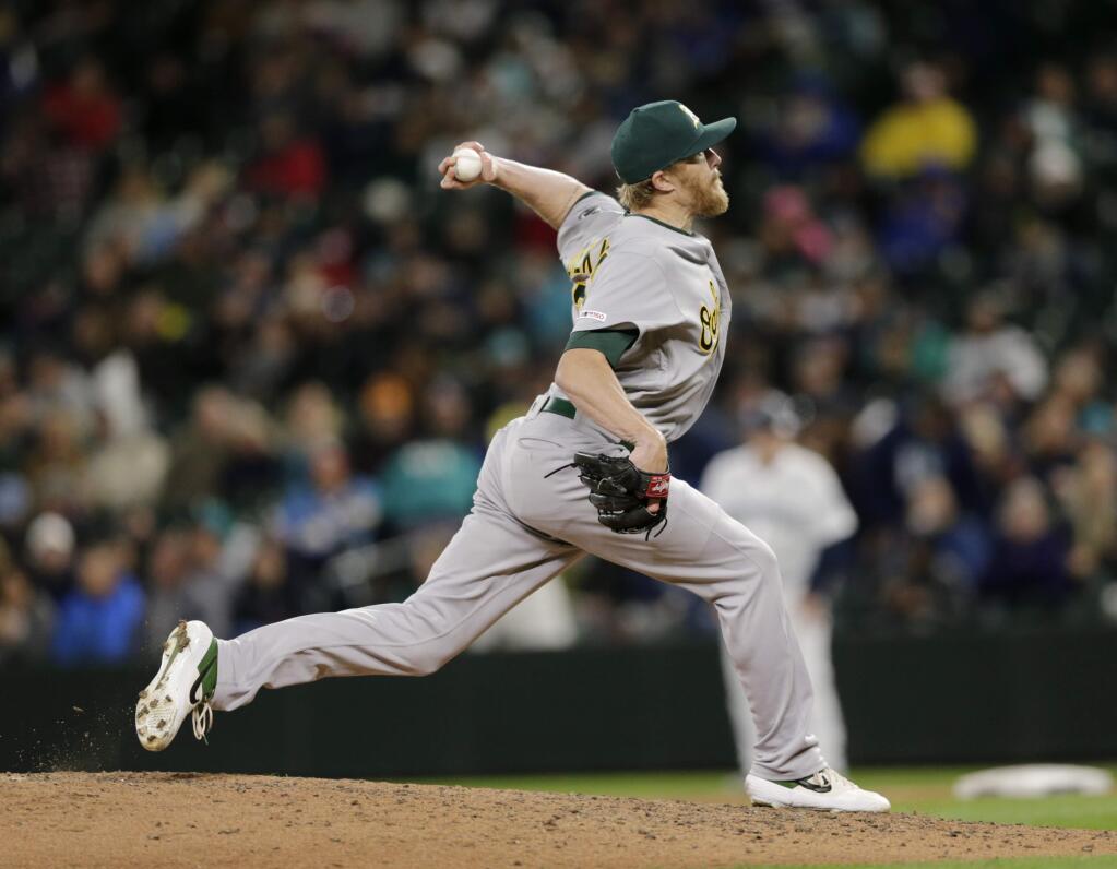 Oakland Athletics relief pitcher Jake Diekman works against the Seattle Mariners, Saturday, Sept. 28, 2019, in Seattle. (AP Photo/John Froschauer)