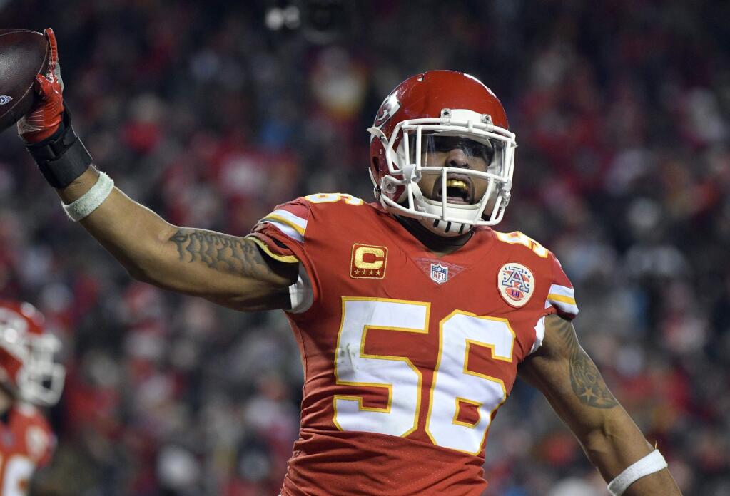 Kansas City Chiefs linebacker Derrick Johnson celebrates what he thought was a touchdown on a Tennessee Titans fumble during the second half of a wild-card playoff game in Kansas City, Mo., Saturday, Jan. 6, 2018, but the play was reversed. The Tennessee Titans won 22-21. (AP Photo/Ed Zurga)