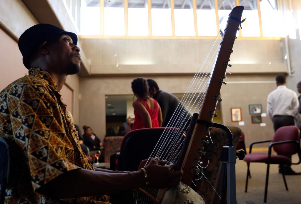 Musician Keenan Webster plays a West African string instrument called a Kora as guests arrived for the 8th annual Entrepreneurs Scholarship Gala presented by the Entrepreneurs of Tomorrow Foundation in Santa Rosa, California on Saturday, September 19, 2015. (Alvin Jornada / The Press Democrat)