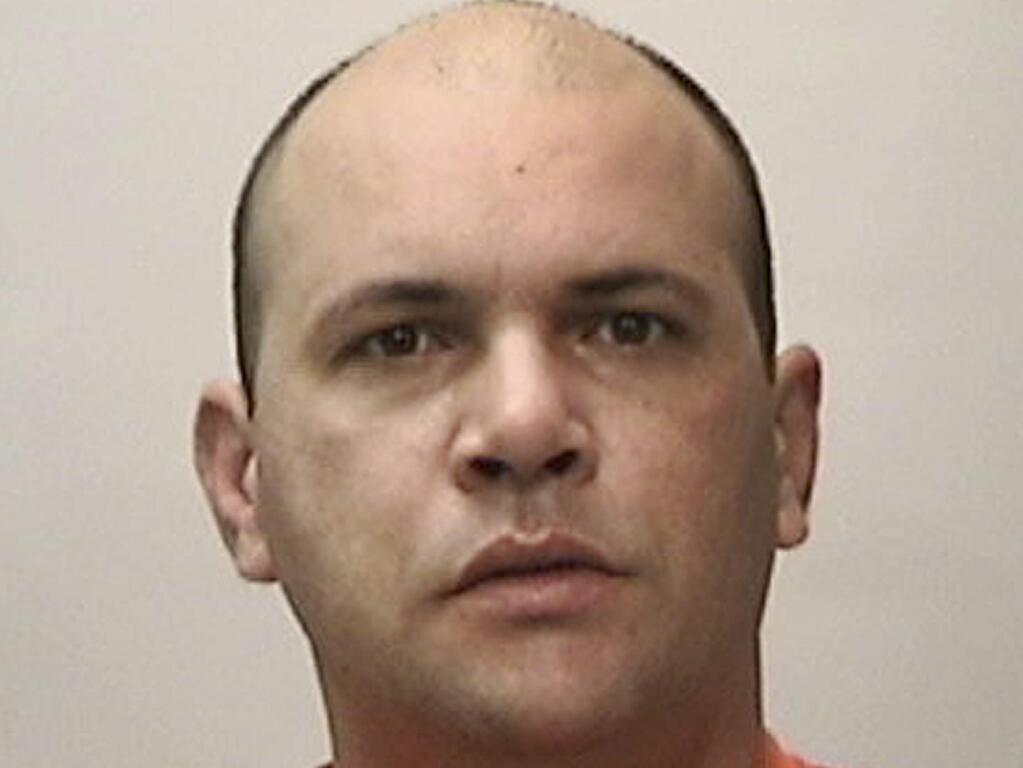 This booking photo released by the San Francisco Police Department shows Emerson Decarvalho, an Uber driver accused of running down and seriously injuring a bicyclist in an apparent road-rage incident. San Francisco police arrested Decarvalho on Sunday, April 19, 2015, in the city's Fisherman's Wharf area, a popular tourist destination. (San Francisco Police Department via AP)