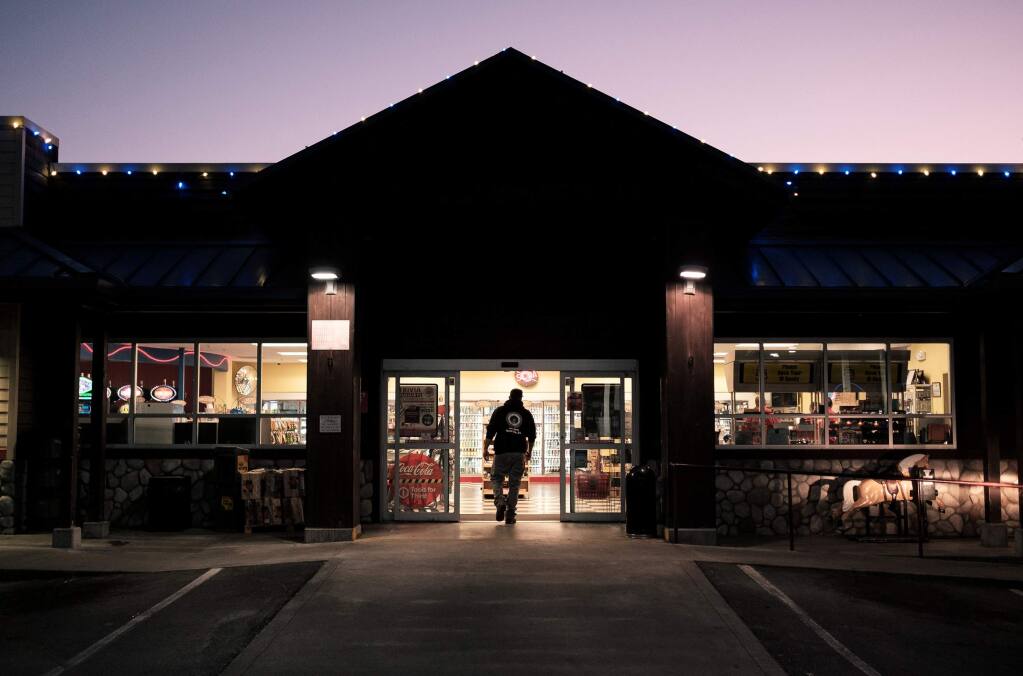 A customer walks into the Play Station 777 market in Blue Lake, Calif. The Blue Lake Rancheria tribe's microgrid allowed power to stay on during recent wildfire-related outages. (Photo by Mason Trinca for The Washington Post)