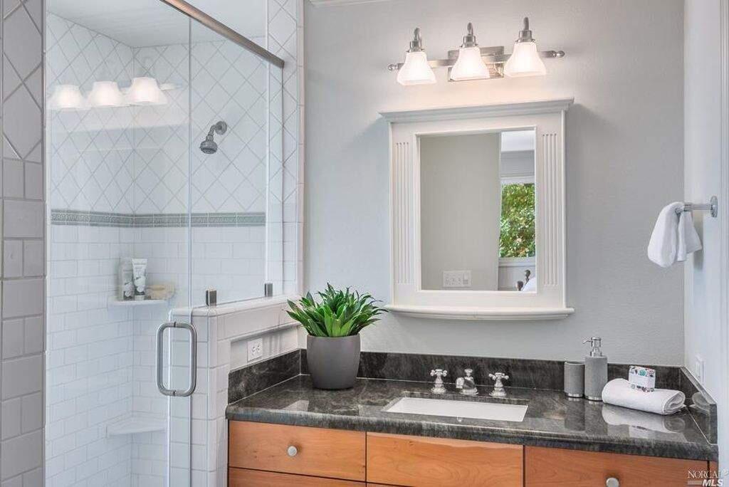 A crisp white bathroom at 1682 Ridge Road, Sonoma. Property listed by Christine Krenos/ Compass, compass.com, 707-227-8661. (Courtesy of BAREIS)