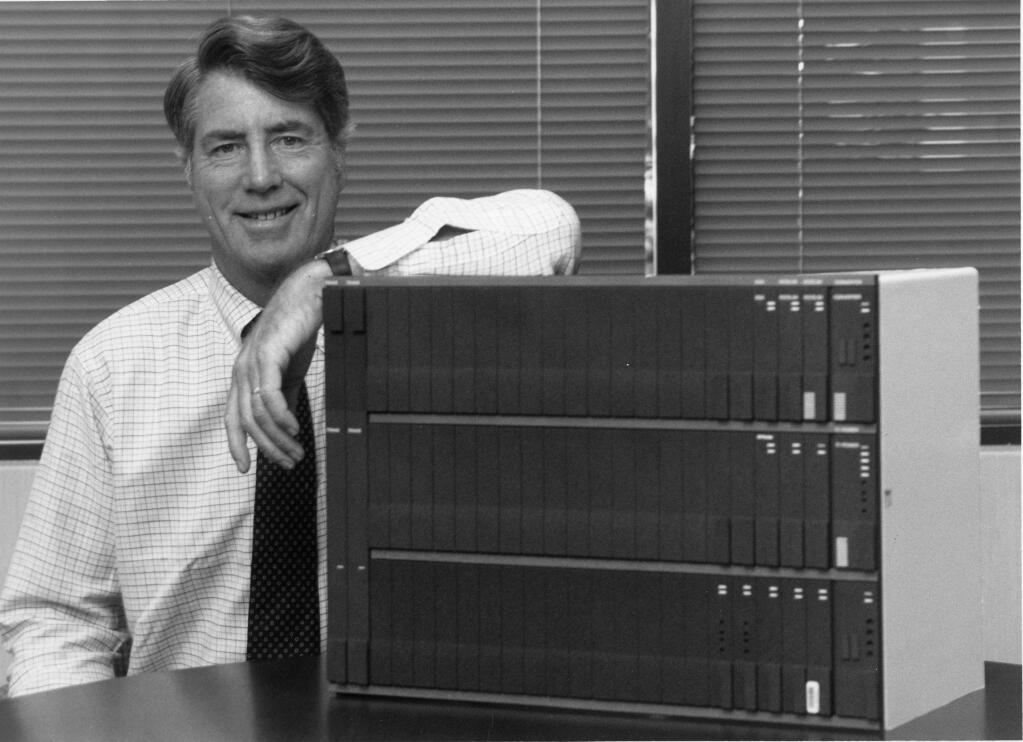 Optilink founder Don Green is shown in August 1988 with a with mock-up of new product that converts wire signals -- voice, data and video -- to multiplexed fiber-optic signals. (PRESS DEMOCRAT FILE PHOTO)