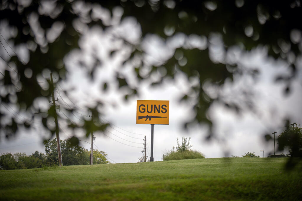A sign outside a gun shop and shooting range in Blue Springs, Mo., on Sept. 3, 2021. Missouri’s Second Amendment Preservation Act declares that state firearms laws “exceed” the federal government’s power to track, register and regulate guns and gun owners. (Christopher Smith/The New York Times)