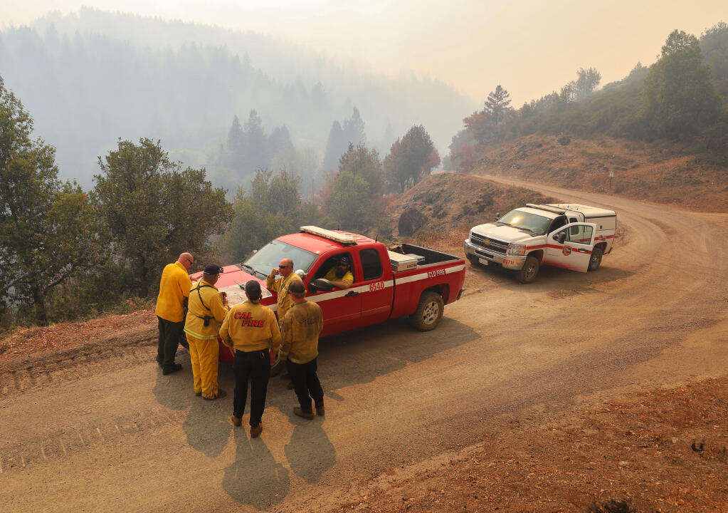 Cal Fire personnel make plans for fighting the Walbridge fire along Chemise Road, west of Healdsburg on Friday, Aug. 21, 2020.  (Christopher Chung/ The Press Democrat)